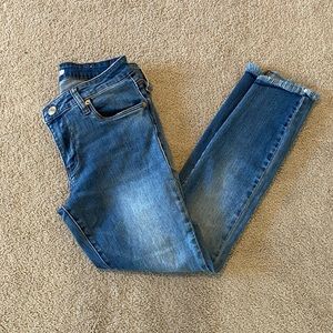 STS blue skinny jeans w/ frayed asymmetrical ankle
